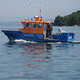 Rettungsboot Berufsschiff / Außenborder / Aluminium / Festrumpf
